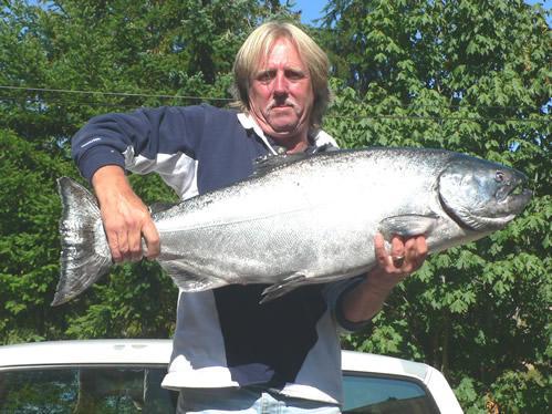 Another happy D&D Fishing charters customer showing off his big beautiful Chinook salmon.