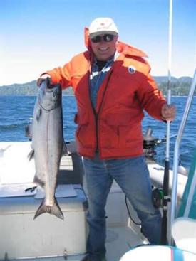 A happy D&D Fishing Charters client shows off his catch. 